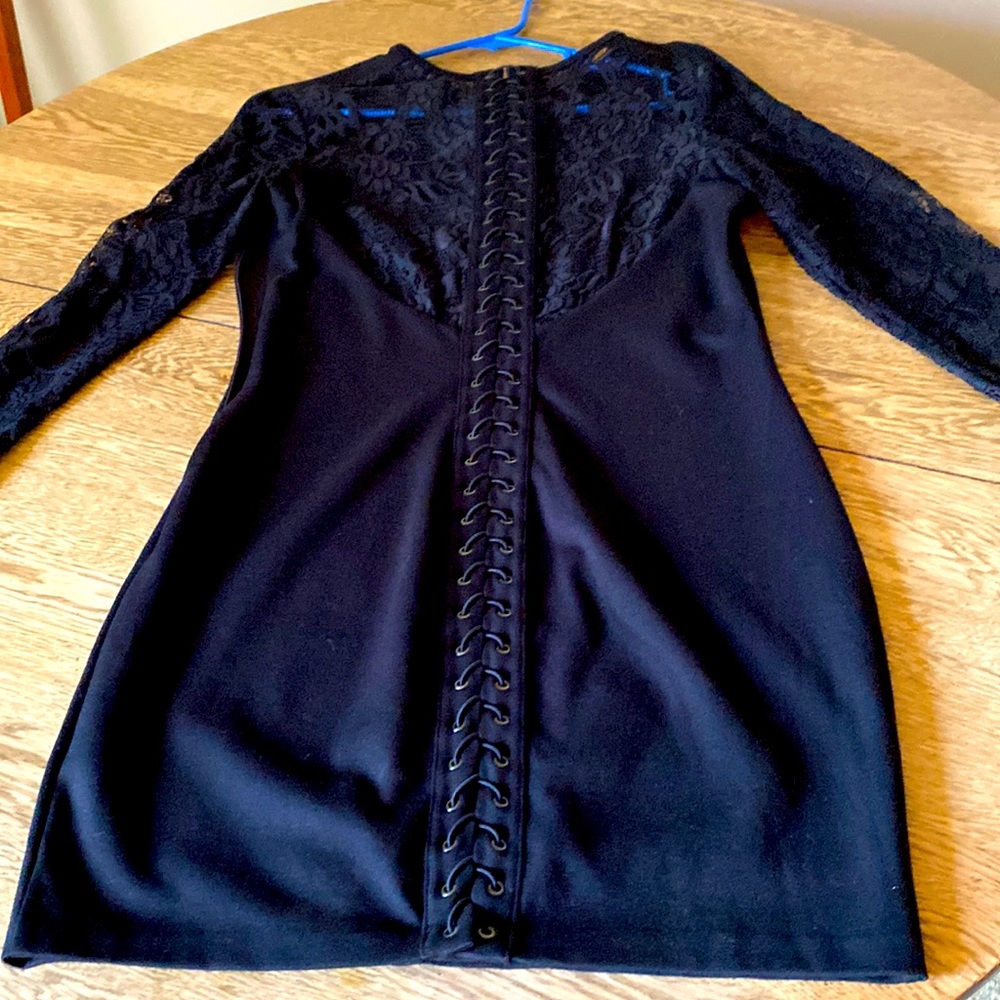 Black sexy form fitting dress with all laced up back